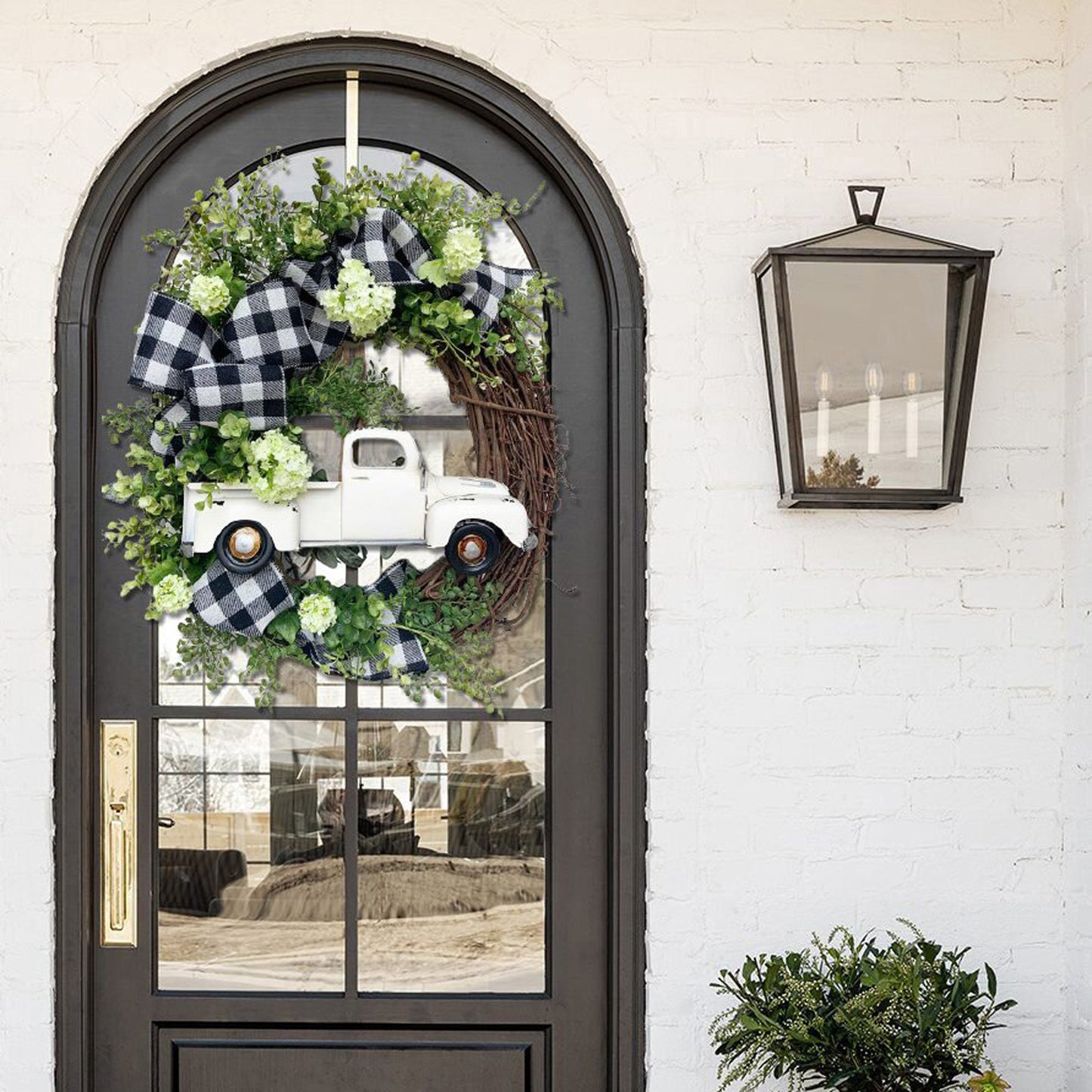 White Truck Wreath with Black and White Ribbon and Seasonal Flower Accents